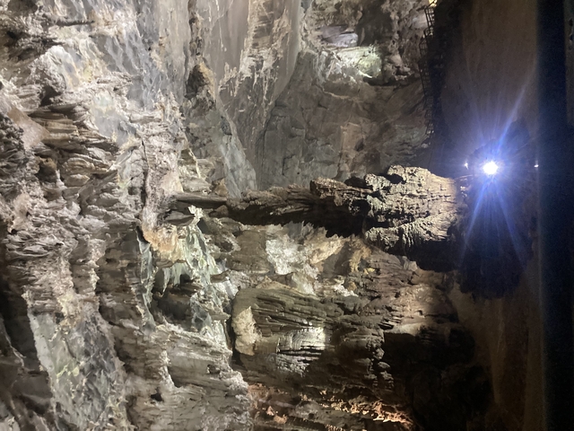 Inside of a cave with dramatic lighting on geological formations