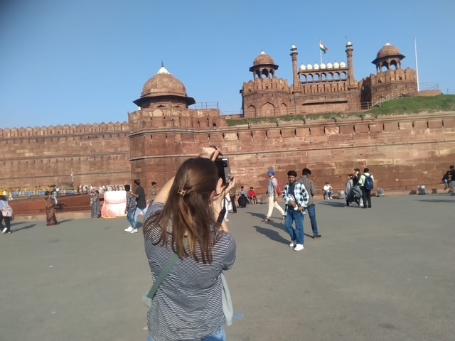Tourists in front of a large historic fort