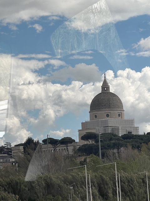 Large domed building against a cloudy sky