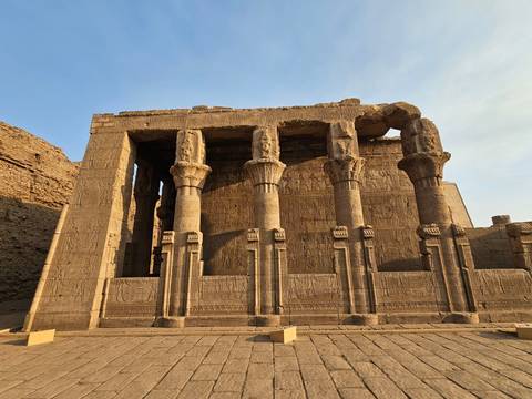       Ancient Egyptian temple columns with carvings.
  