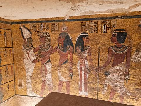 Colorful hieroglyphics on the walls of an Egyptian tomb.