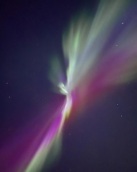       Colorful aurora borealis in the night sky.
  