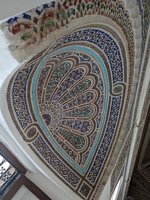       Detail of an ornate plasterwork pattern.
  