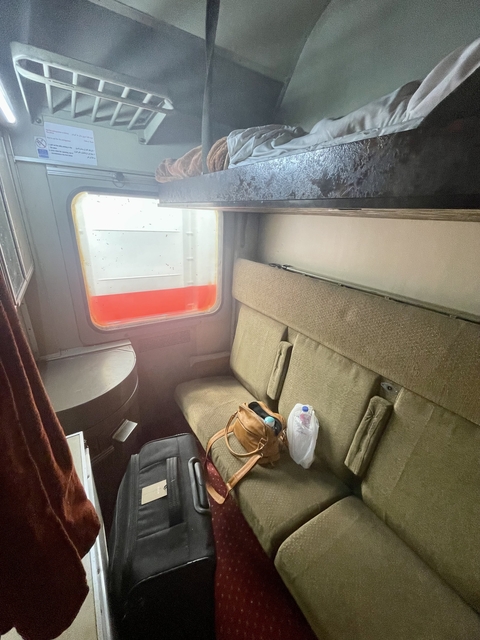 Small seating area inside a train cabin.