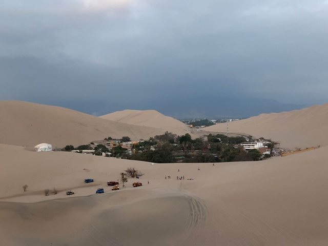       Town surrounded by sand dunes.
  