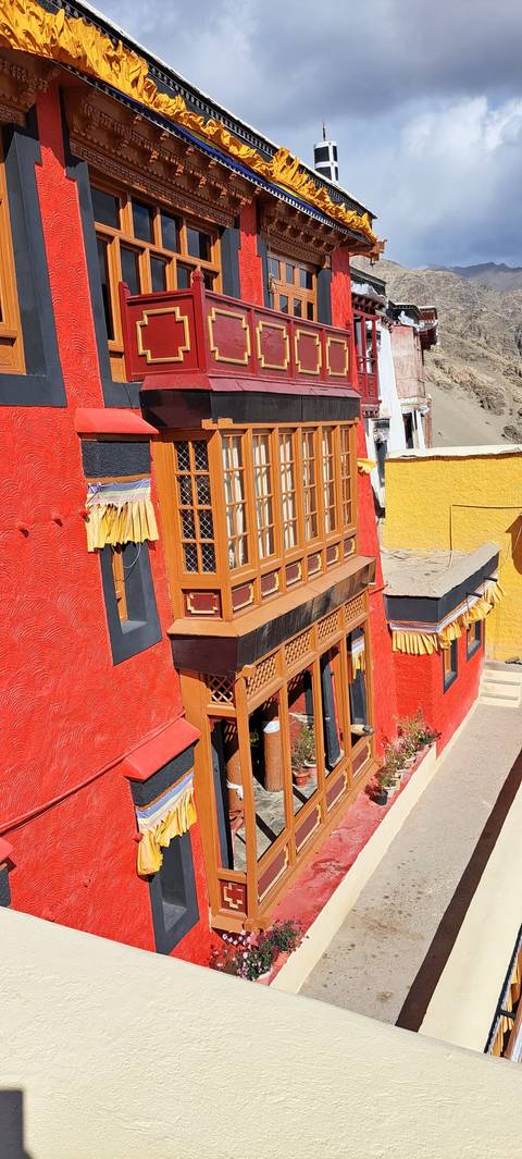 Building facade with colorful trim and decor.