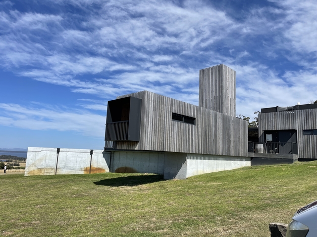       Modern architectural building with a clear sky.
  