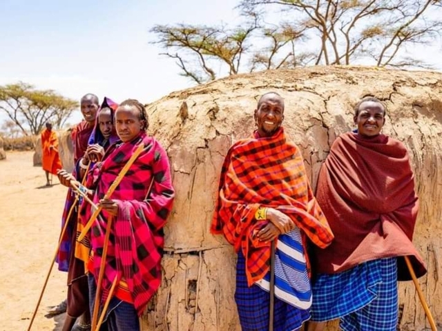 Group of Maasai people in traditional attire.