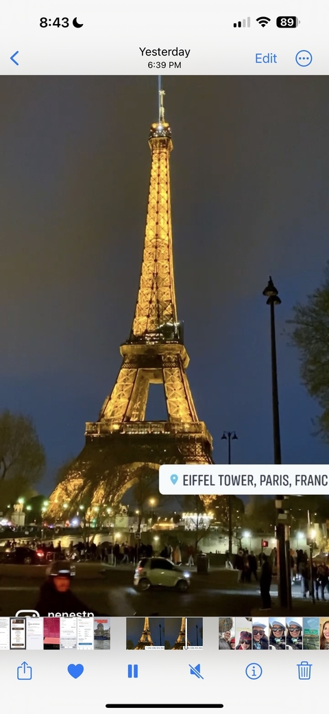 Eiffel Tower illuminated at night.