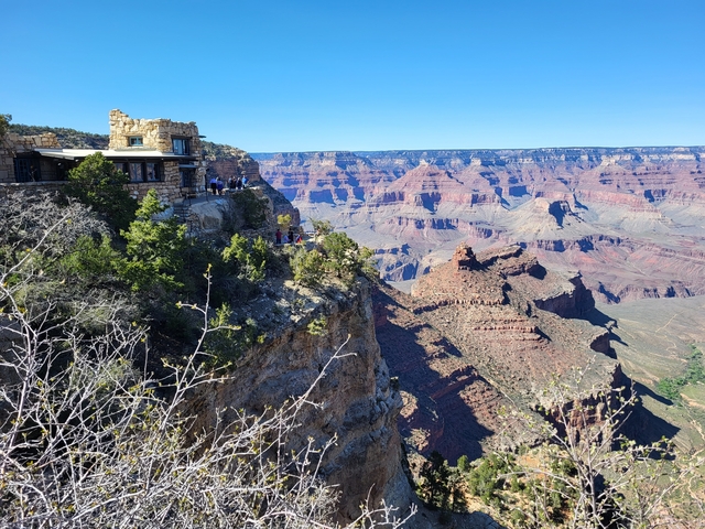 Scenic view of the Grand Canyon with a visitor center.
