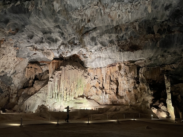 Interior of a cave with stalactites and stalagmites.