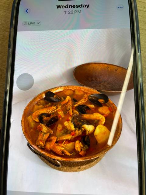 Seafood dish with text overlay.