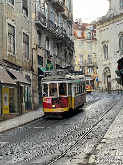       Traditional tram running on city streets.
  