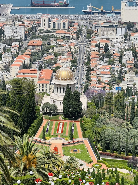       Bahá'í Gardens with dome and cityscape.
  