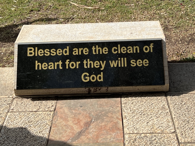 Sign with a biblical quote.