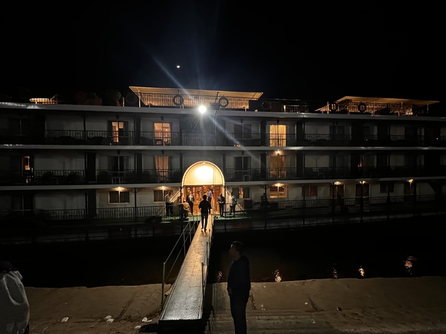       Night view of a Nile river cruise boat.
  