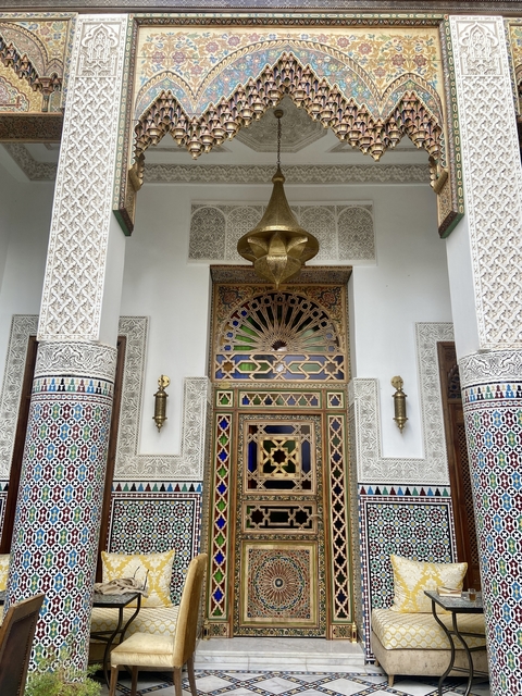       Intricately designed Moroccan doorway with colorful tiles.
  
