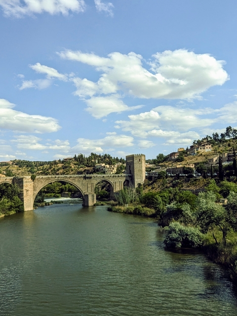       Interior of a historic building with ornate columns and arches.
  