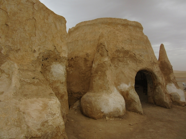 Traditional desert structures built into rocks.