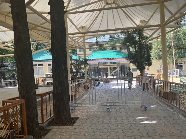 Entrance area with a building in the background.