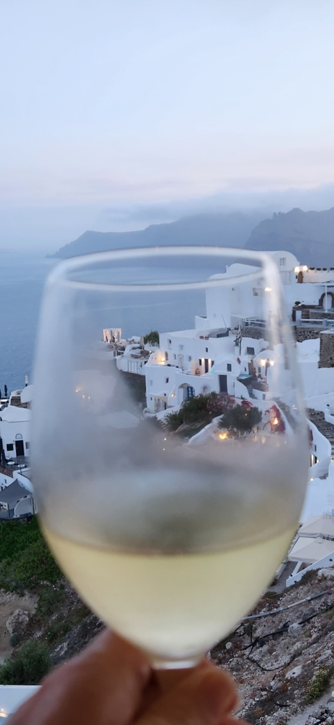 View of Greek-style architecture through a glass.