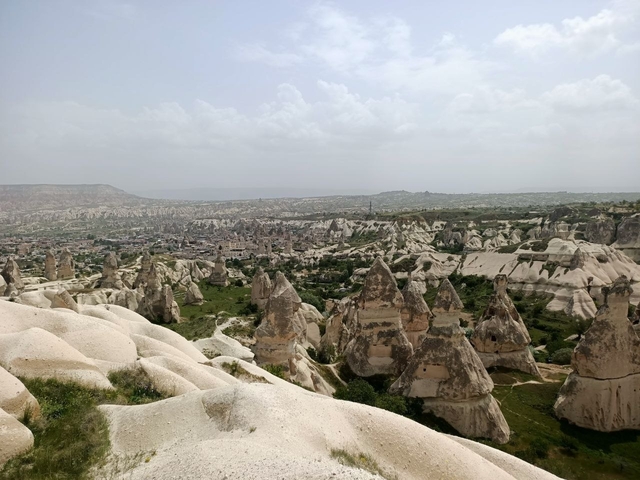 Panoramic view of a valley with rock formations.