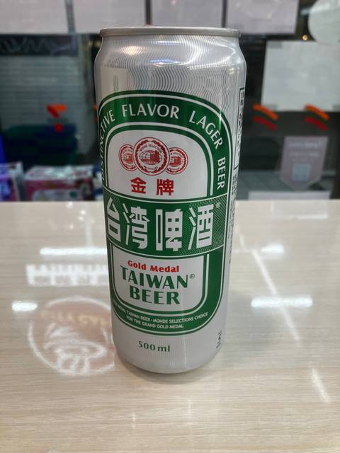 Beer can with text 'Taiwan Beer'.