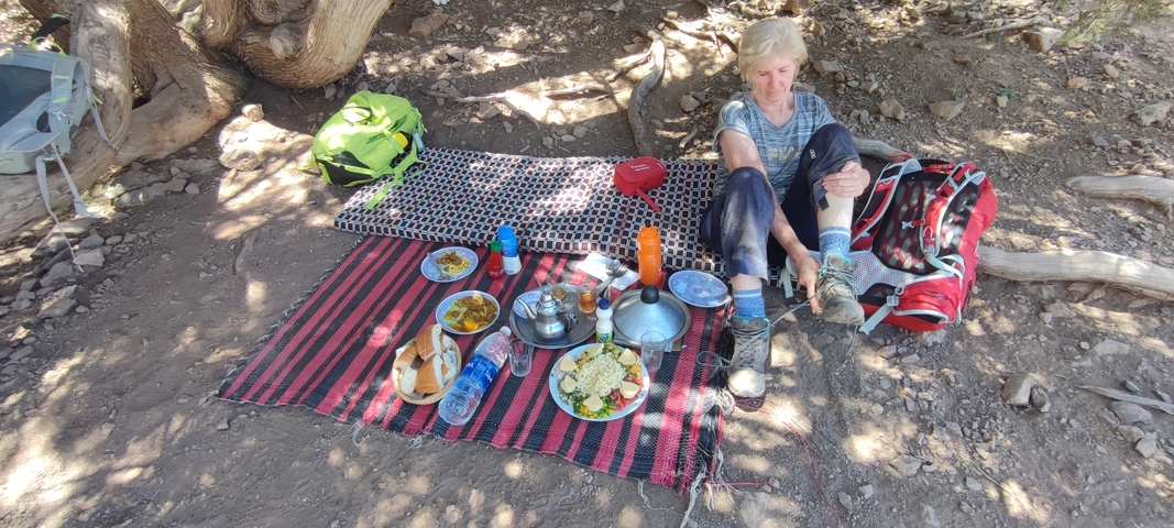       Picnic setup in the mountains with a backpacker.
  