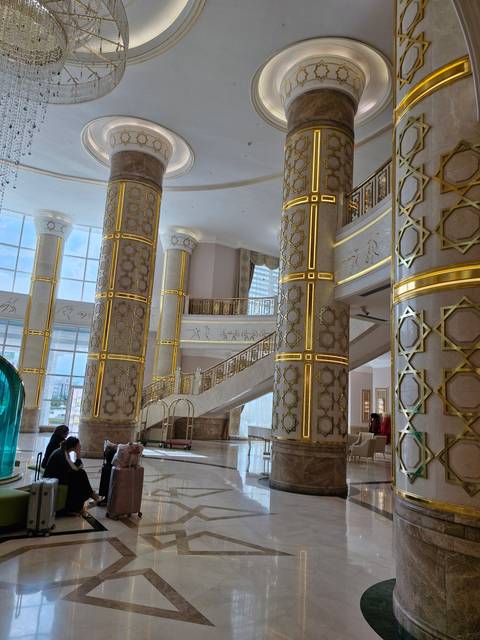 Elegant interior with tall pillars and intricate design elements.