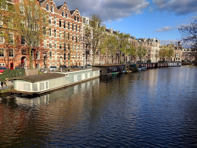 Houseboats along a canal in Amsterdam.