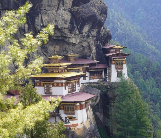       The famous Tiger's Nest Monastery in Bhutan's mountains.
  