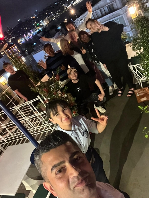       A group of people enjoying a casual gathering outdoors.
  