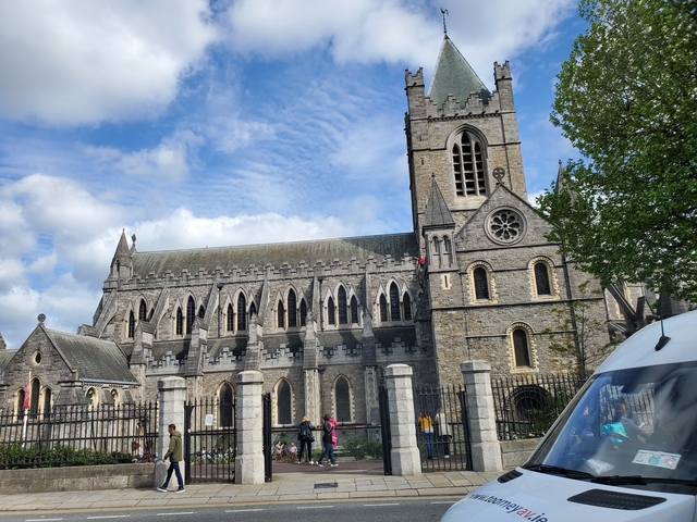 Exterior view of a large cathedral under a blue sky.