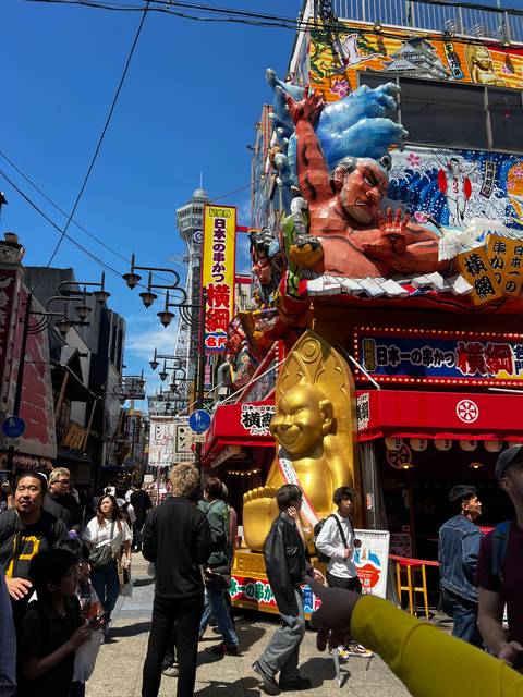       Colorful theme park entrance with large character statues.
  