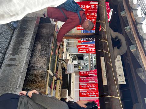       Shrine or temple activity with people participating.
  