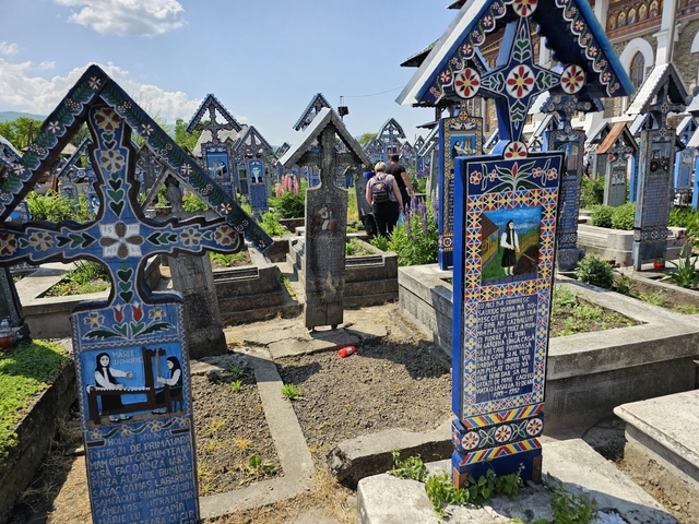 Colorful painted gravestones in a cemetery.