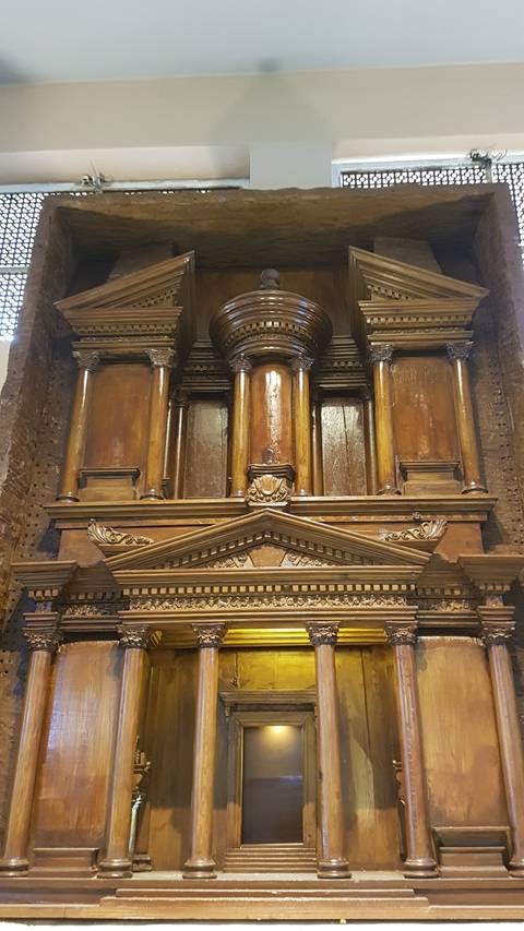       Wooden architectural details on a ceiling.
  