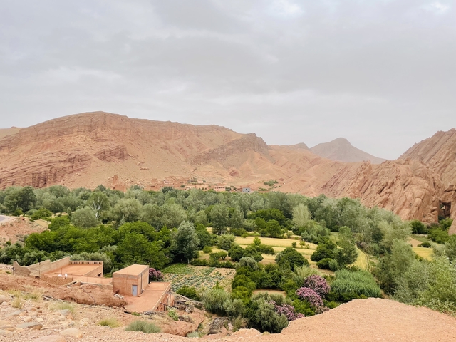       Mountain landscape with green valleys and sparse settlements.
  
