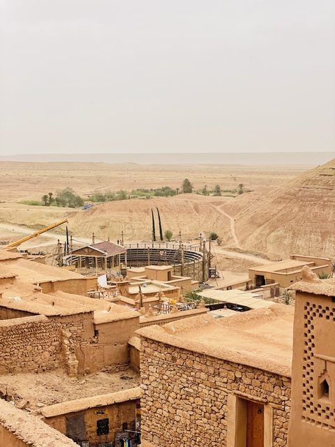 Circular arena surrounded by desert landscape.