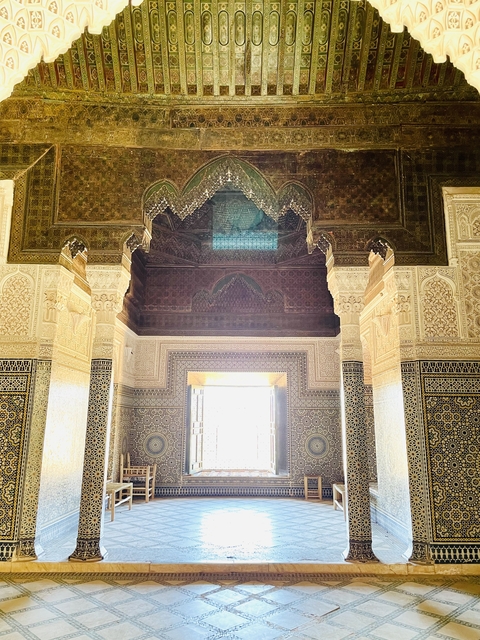 Ornate interior of a Moroccan building with intricate patterns.