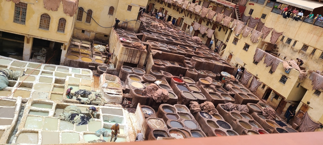       Traditional tannery with colorful dye vats in Fes.
  