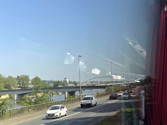 View of a bridge from a bus window.