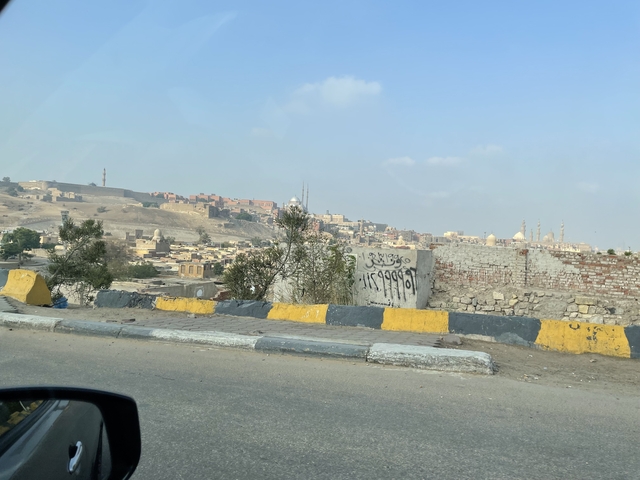 Cityscape view with construction sites from a vehicle.