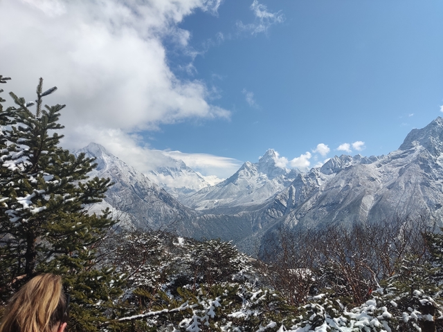       Panoramic snowy mountain range with clear blue skies.
  