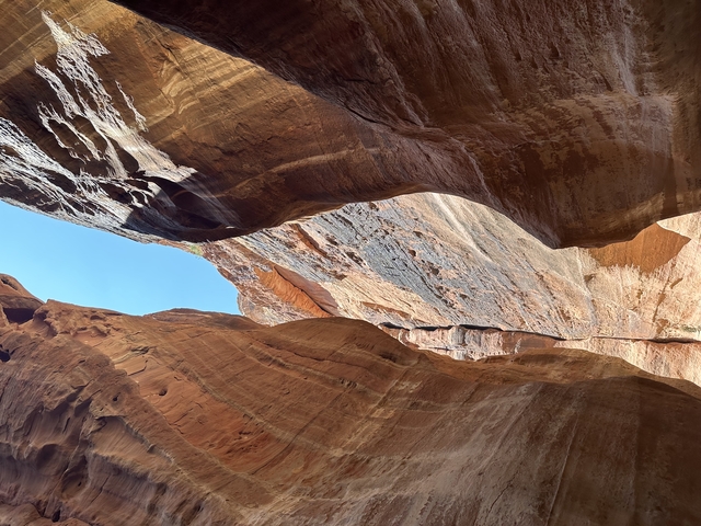 Narrow canyon with a view of the sky.