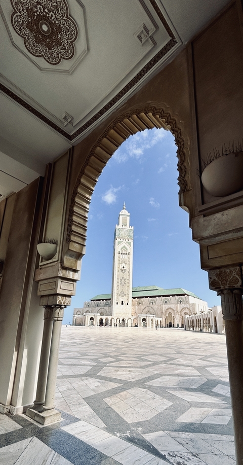 Ornate mosque architecture with a clear sky.