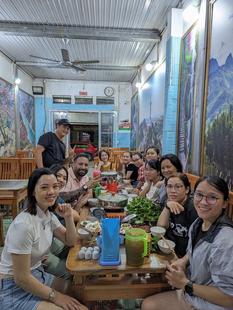       Group of people dining together at a restaurant.
  