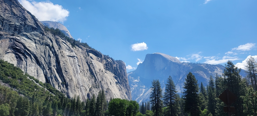Dramatic mountain peaks under a clear blue sky.
