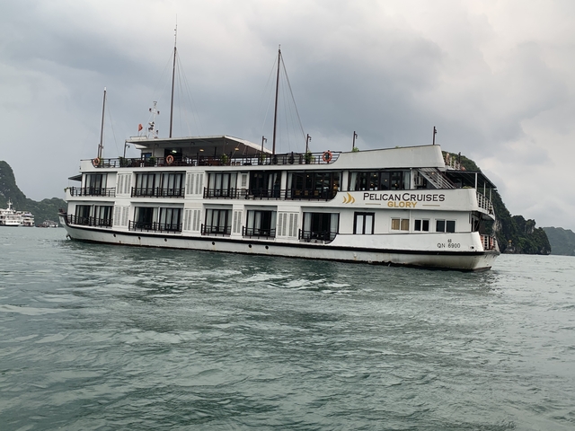 A cruise ship named Pelican Cruises Glory on a calm sea