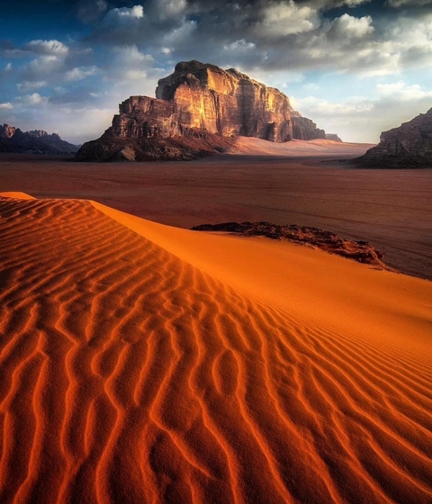 Desert sand dunes with ripples in the foreground